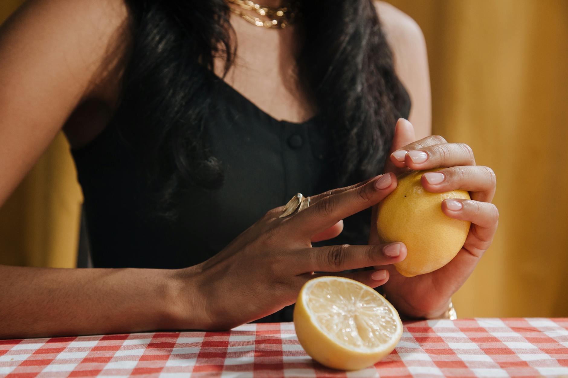 Close-up of hands holding a blue vibrator against a purple background, emphasizing gentle touch and reconnection