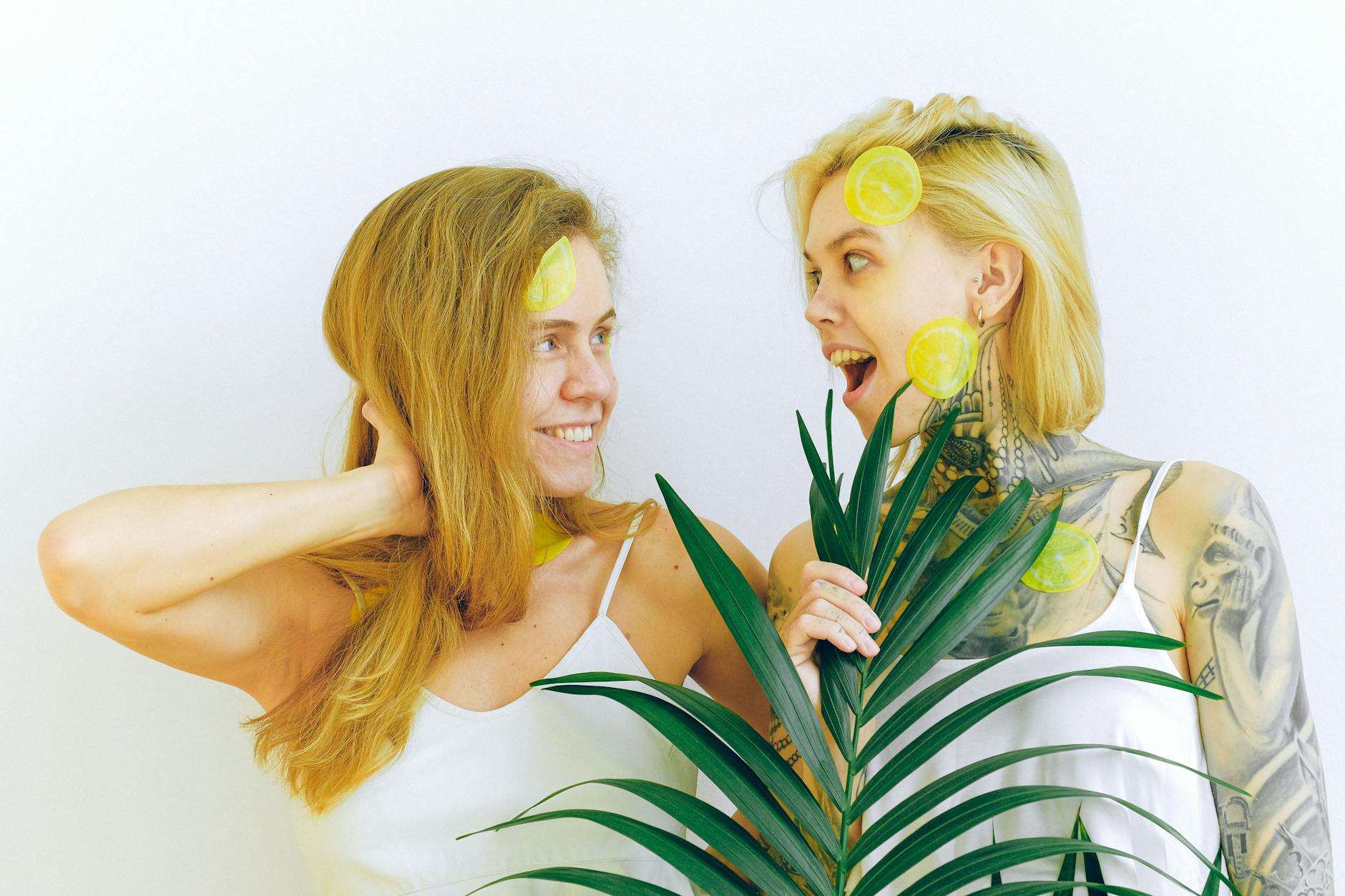 Two fresh lemons held in cupped hands, symbolizing gentle pressure and release